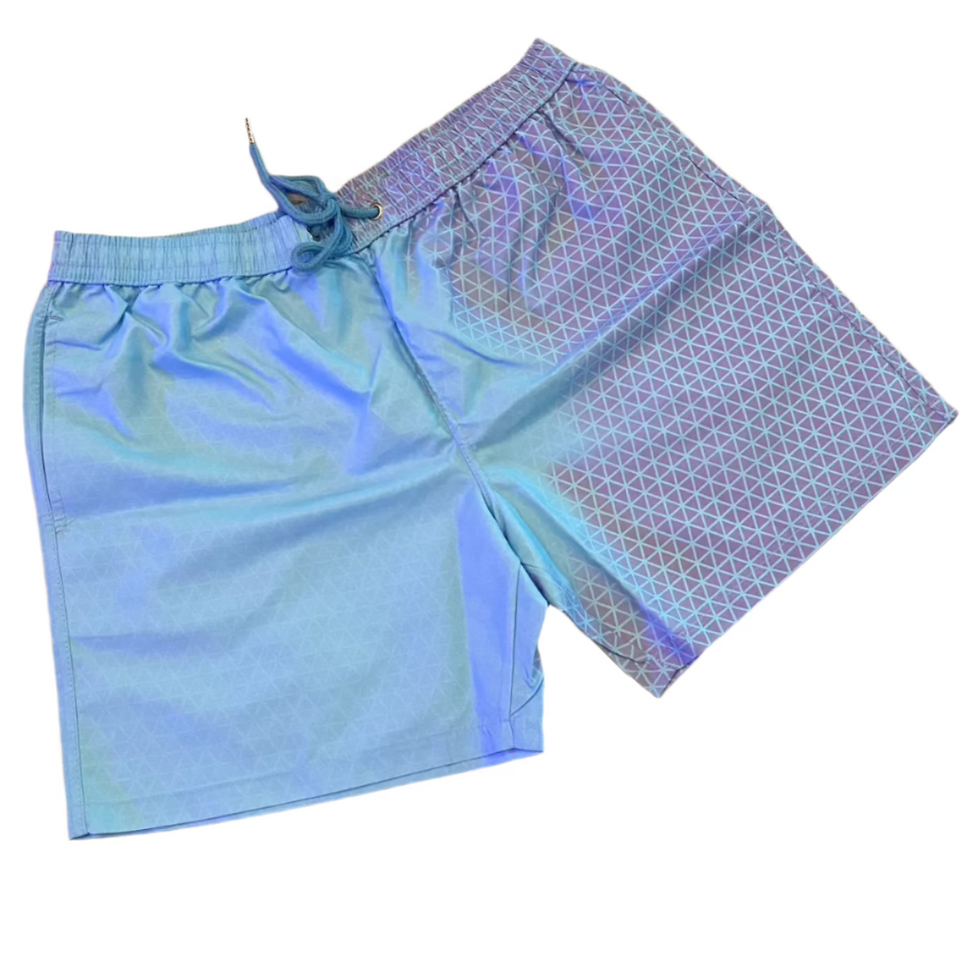 Explore our Geo Pattern Men Color Changing Trunks in light blue, showcasing a striking triangle pattern on one side and a solid color on the other. Designed with a drawstring waistband for enhanced comfort, these trunks are perfect for those who value bold style and practicality at the beach or pool.