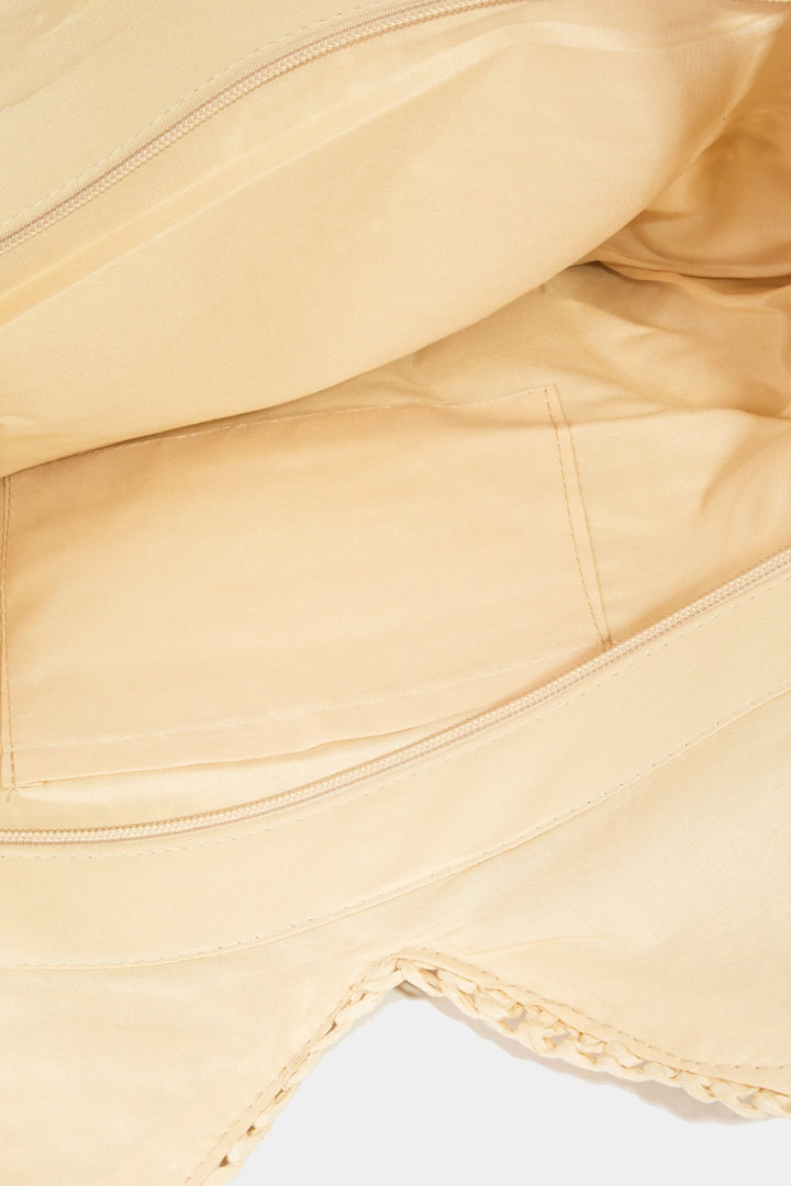 Close-up of the Fame Straw Braided Faux Leather Strap Shoulder Bag in beige, featuring a smooth faux leather appearance with visible light stitching, a zipper, and an interior open pocket positioned beneath it.