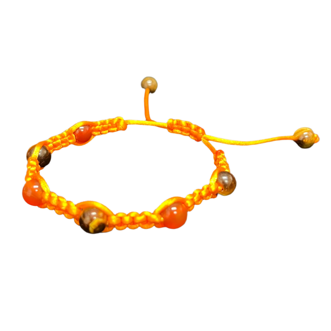 Introducing the Gem and Stone Beach Bracelets by Claire: A vibrant orange beaded bracelet with a knot fastener, adorned with circular stones and unique gemstone accents, beautifully displayed on a plain black background.