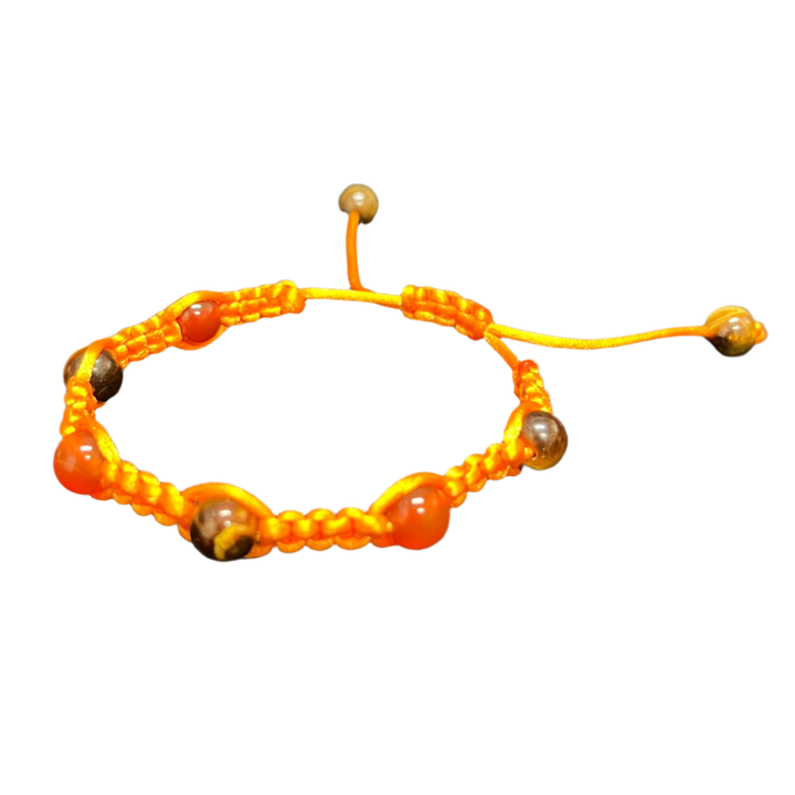 Introducing the Gem and Stone Beach Bracelets by Claire: A vibrant orange beaded bracelet with a knot fastener, adorned with circular stones and unique gemstone accents, beautifully displayed on a plain black background.