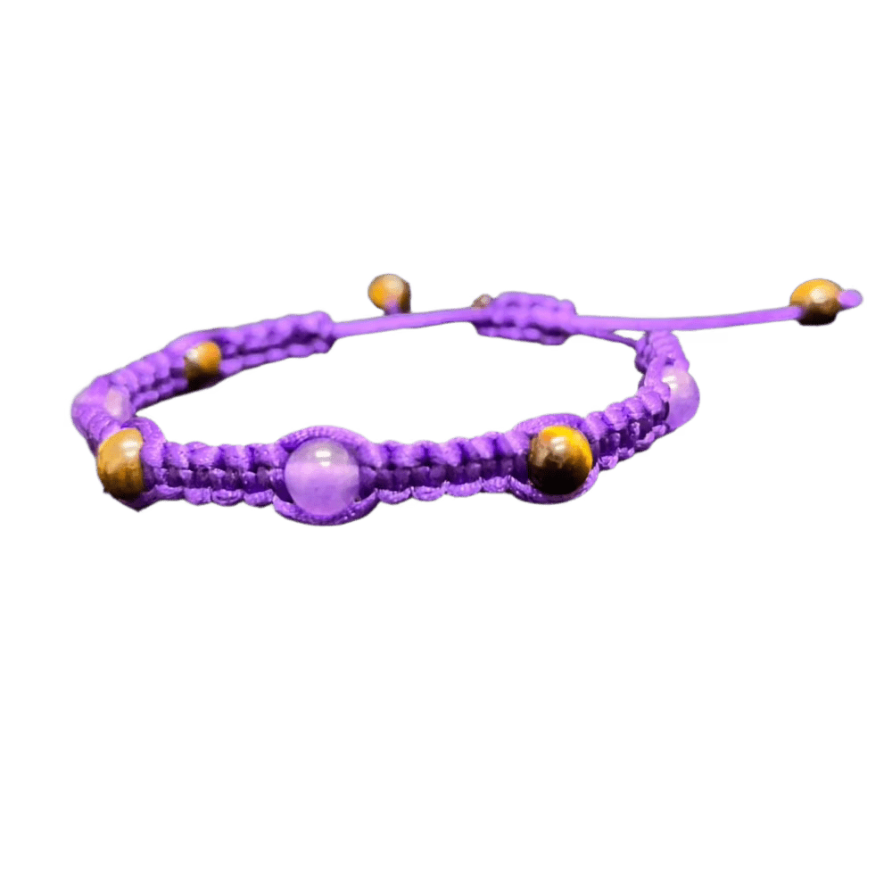 Introducing the Gem and Stone Beach Bracelets by Claire, this unique purple braided macrame bracelet showcases alternating purple and brown round beads. Set against a black background, its intricate design and vibrant colors truly stand out.