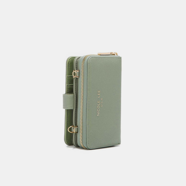 Nicole Lee USA 2 Piece Phone Case Crossbody Wallet in green vegan leather features a wrist strap, gold accents, and the NICCOLE LEE USA text in gold. It offers multiple compartments, blending functionality and style for the modern individual.