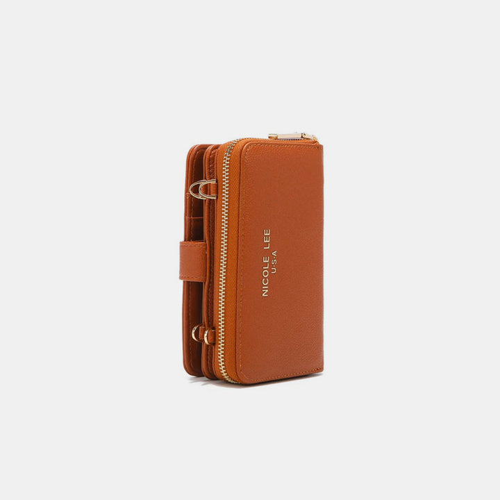 The Nicole Lee USA 2 Piece Phone Case Crossbody Wallet features brown vegan leather, a gold zipper, multiple compartments, and a side strap. Embossed with NICOLE LEE USA in gold, it sits against a light gray background.