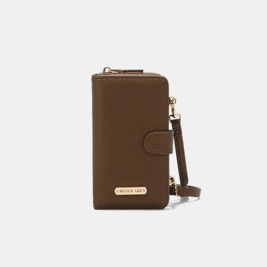 The Nicole Lee USA 2 Piece Phone Case Crossbody Wallet in brown vegan leather features a wrist strap, gold hardware, nameplate, top zipper, snap closure, and a sleek minimalist design that can be conveniently worn as a crossbody.