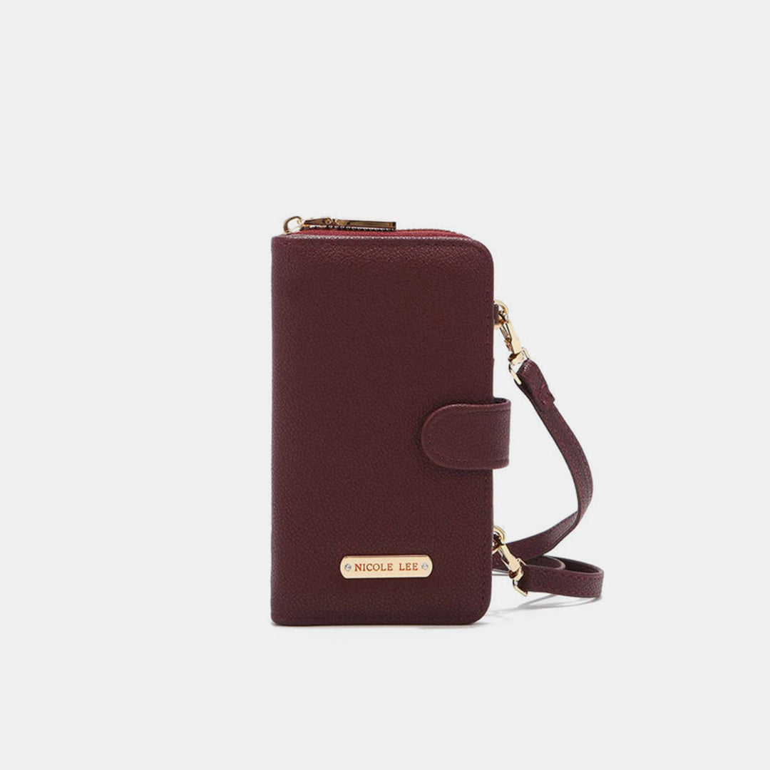 Burgundy Nicole Lee USA 2 Piece Phone Case Crossbody Wallet with zippered closure, wrist strap, vegan leather, gold-tone Nicole Lee label on the front, snap button flap, and textured design against a plain white background.