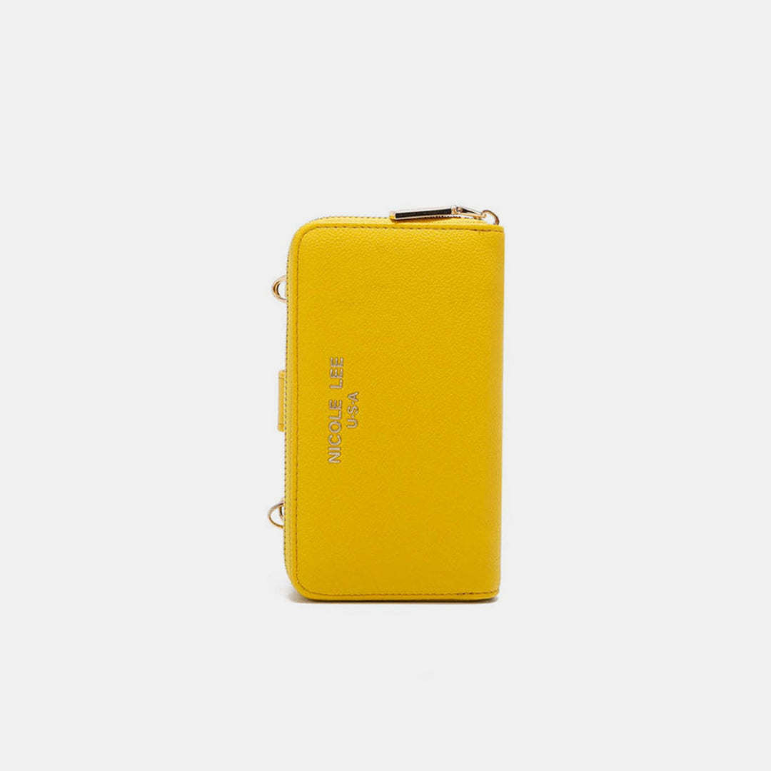 The Nicole Lee USA 2 Piece Phone Case Crossbody Wallet in yellow is made of vegan leather and features a zip closure. It’s embossed with NICOLERAE USA and adorned with metal accents on the strap attachments, showcasing a simple yet elegant design that complements any plain white backdrop.