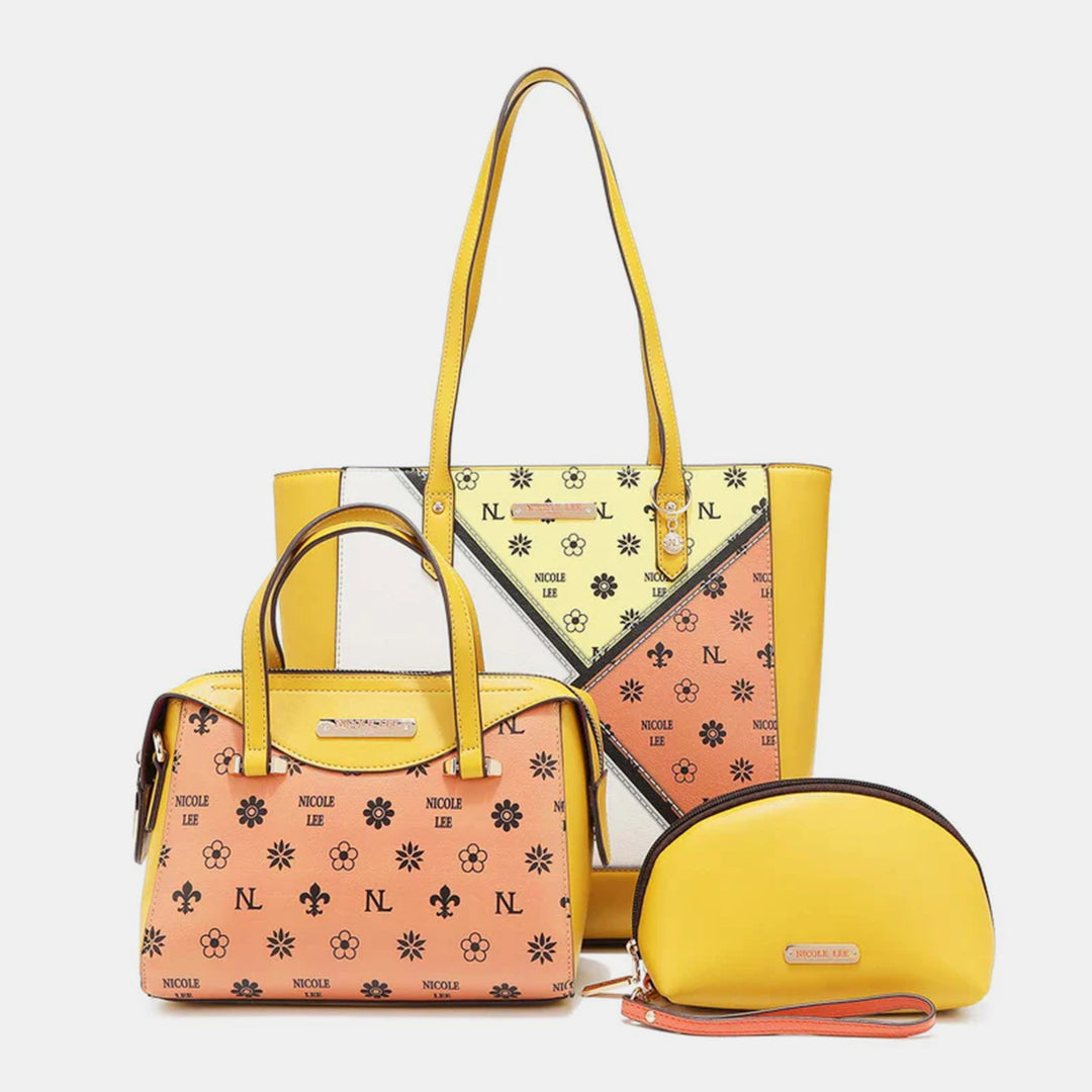 Explore the Nicole Lee USA 3-Piece Color Block Handbag Set featuring a large geometric-patterned yellow tote, a medium peach handbag with floral and logo designs, and a small round yellow clutch. Each vegan leather bag has distinctive decorative motifs and subtle branding.