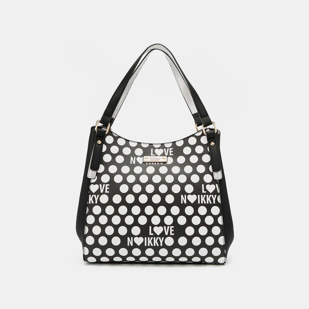 The Nicole Lee USA Contrast Polka Dot Handbag is a black and white vegan leather bag featuring Love and Nokky prints, gold-tone hardware, and black handles, offering a chic blend of simplicity with style.