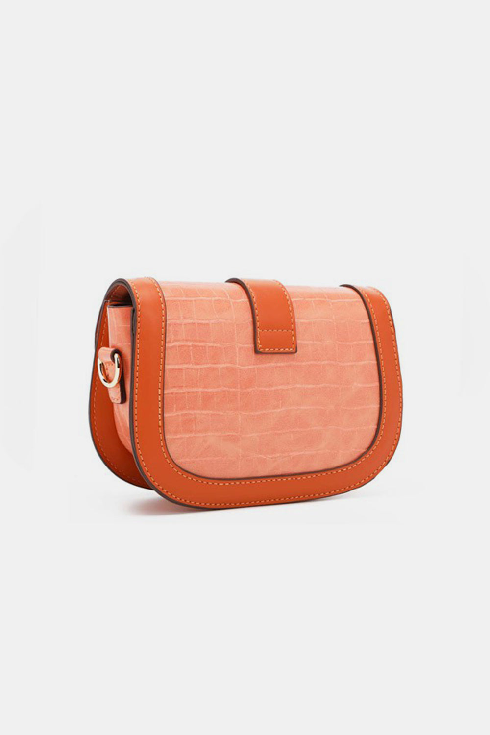 The Nicole Lee USA Croc Embossed Crossbody Bag is a small, stylish accessory made from eco-leather. It features a textured, light orange crocodile pattern with dark orange trim, complete with a flap closure and an adjustable shoulder strap.