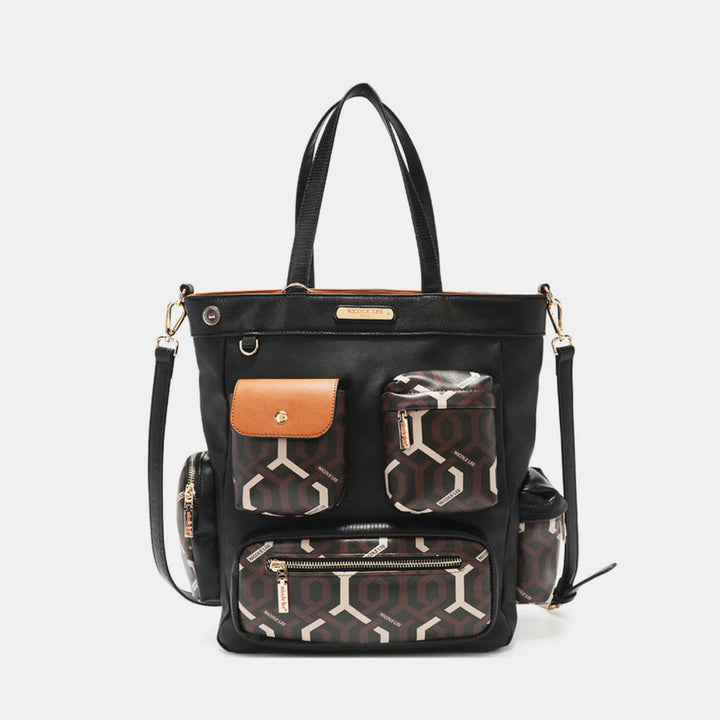 The Nicole Lee USA Geometric Pattern Tote Bag is crafted from vegan leather and features black with brown geometric patterned front pockets and a small tan flap pocket. Its adjustable straps and gold hardware accents highlight its sleek design, making it a chic, neutral accessory perfect for any outfit.