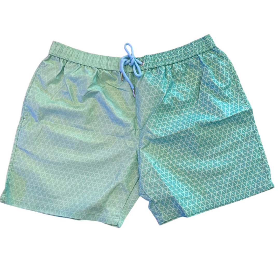 Discover the Geo Pattern Men Color Changing Trunks: light green swim shorts featuring an adjustable drawstring waistband. The fabric reveals a subtle geometric pattern of overlapping triangles for a textured appearance. Laid flat on a white background, they're ready for your next adventure.