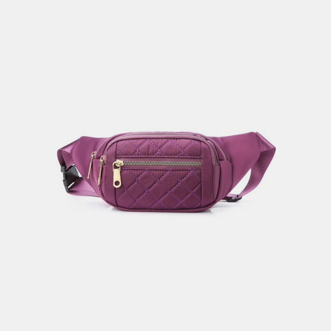 Introducing the Zenana Quilted Multi Pocket Waist Belt Bag in purple, designed with luxurious gold hardware and an adjustable strap for convenient hands-free use. It features a small zippered front pocket ideal for organizing essentials, all set against a simple white background.