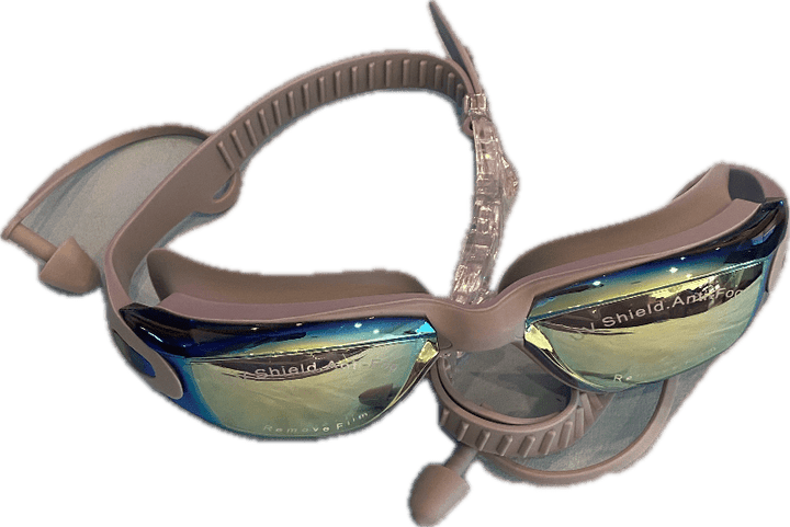 The Polycarbonate Lens Swim Goggles with built-in ear plugs for adults are showcased against a white background. They feature shatter-resistant, mirrored lenses with UV protection. The gray adjustable straps ensure a secure fit, complemented by a protective film on the lenses for clarity and safety.