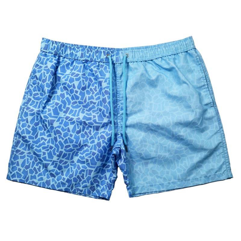 Color changing trunks diamond pattern that transform from various blue shades patterns to light blue when activated by temperature- Kameleon Swim