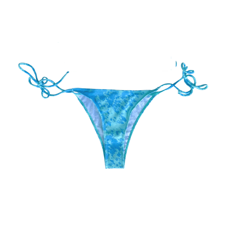 Color changing Atlantic string bikini bottom that is partially changed.  Full change of color comes with temperature changing the bikini from blue to light blue when activated. Kameleon Swim