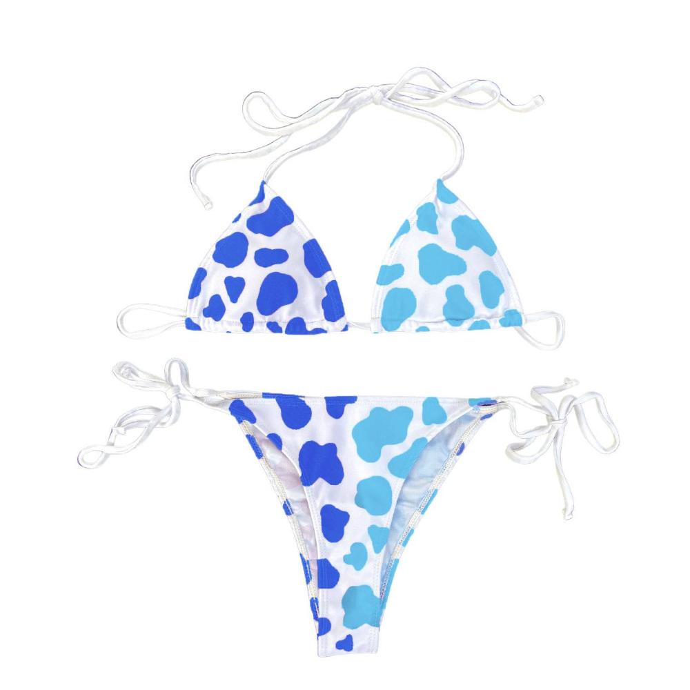 Cow print in our Atlantic color is shown on this string bikini suit.  The colors change when they are activated by certain temperature changes, changing from darker blue to lighter blue. Kameleon Swim