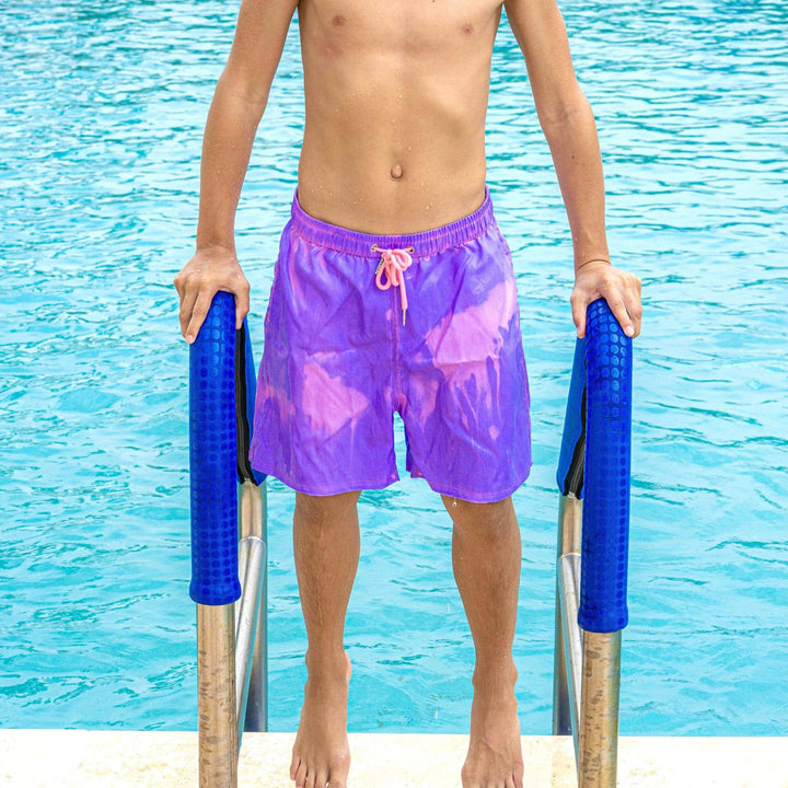 Kid's Kameleon Color Changing Trunks fresh out of the pool wearing cotton candy classic color - Kameleon Swim