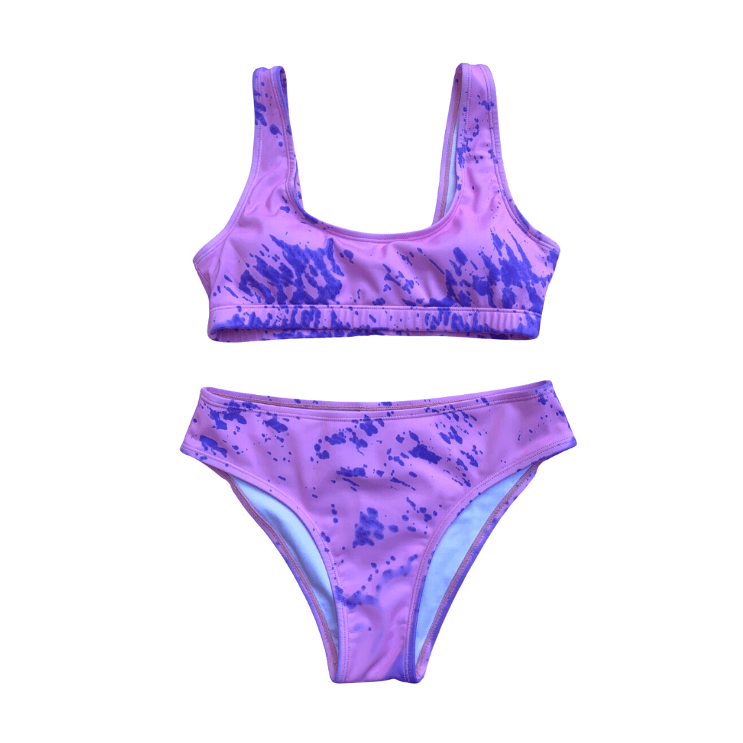 Cotton Candy girls two piece color changing swim suit. Colors change from purple to pink when temperature activates the crystals. Kameleon Swim